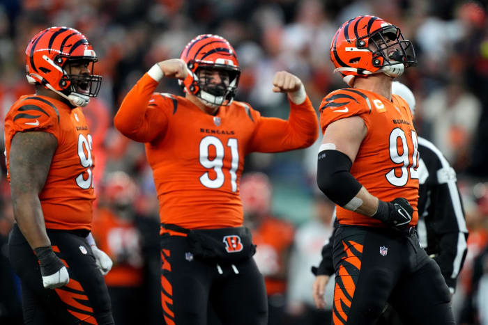 Dec 4, 2022; Cincinnati, Ohio, USA; Cincinnati Bengals defensive end Sam Hubbard (94), far right, celebrates a sack with Cincinnati Bengals defensive end Trey Hendrickson (91), center, and Cincinnati Bengals defensive tackle BJ Hill (92), far left, in the second quarter of a Week 13 NFL game against the Kansas City Chiefs at Paycor Stadium. Mandatory Credit: Kareem Elgazzar-USA TODAY Sports